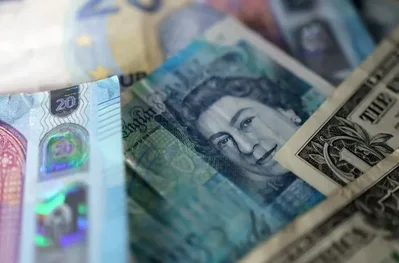 Sterling rises against dollar and euro on risk appetite