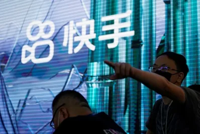 Kuaishou Technology secured over 19 billion yuan from a group of investors to value its AI video division at 15 billion dollars. The capital injection from major tech firms like Alibaba and Tencent will dilute Kuaishou's stake in the unit to 68 percent.