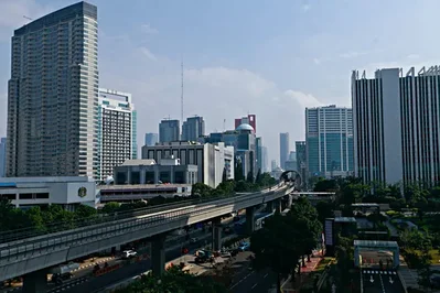 An Indonesian parliamentary panel has approved key provisions for a bill to establish international financial hubs offering 50-year tax holidays. The initiative aims to attract up to 500 trillion rupiah in foreign investment and position Bali or other sites as rivals to Singapore.