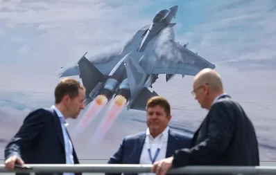 The Farnborough Airshow launched with significant commercial aircraft orders from SMBC Aviation Capital and Riyadh Air. Defense firms are showcasing lower-cost interceptors and drones as global conflicts drive demand for advanced air-defense systems and propulsion technology.