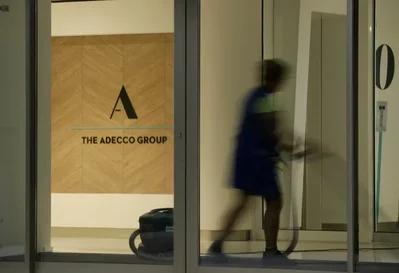 Adecco Group CEO Denis Machuel states that while AI is evolving the workforce, there is no evidence of an impending job apocalypse. Despite recent corporate layoffs, the staffing firm notes that employment rates remain at record highs across OECD member countries.