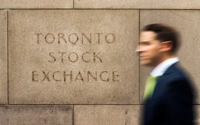 Canada's main stock index climbed 0.5 percent on Friday to end the week higher as gains in financial and industrial shares offset concerns over new U.S. trade tariffs. While energy stocks fell alongside crude prices, real estate and investment firms led the broader market higher.