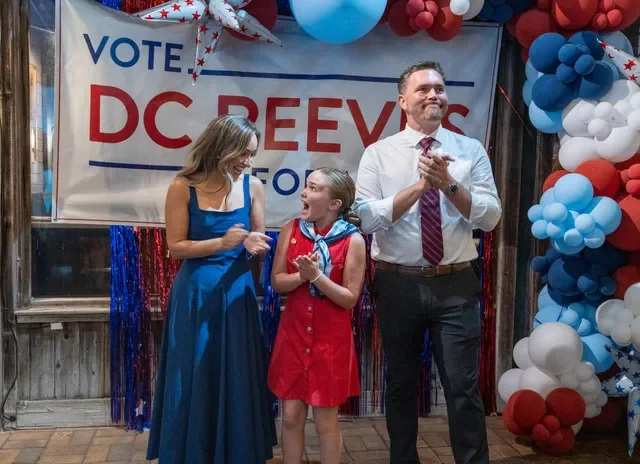 Incumbent Mayor D.C. Reeves, right, and his family react to his re-election during his watch party on Primary Election Day at the Fish House in Pensacola on Aug. 18, 2026.