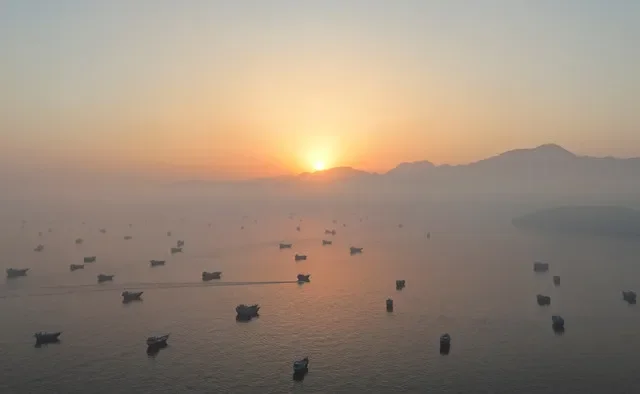 FILE PHOTO: A drone view shows vessels in the Strait of Hormuz, as seen from Musandam, Oman, June 15, 2026.
