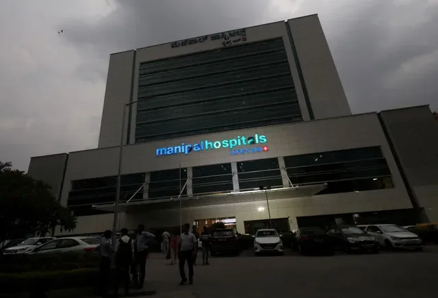 FILE PHOTO: People stand inside the premises of Manipal Hospital in Bengaluru, India, May 26, 2026. REUTERS/Priyanshu Singh/File Photo