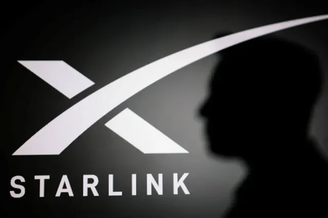 The silhouette of Elon Musk and Starlink logo are seen in this illustration taken June 11, 2026. REUTERS/Dado Ruvic/Illustration