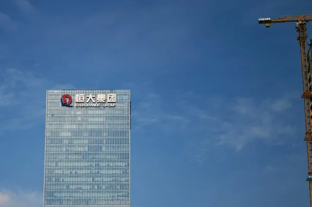 FILE PHOTO: A crane stands at a construction site near the headquarters of China Evergrande Group in Shenzhen, Guangdong province, China, Sept. 26, 2021. REUTERS/Aly Song/File Photo