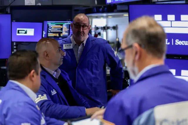 Traders work on the floor of the New York Stock Exchange (NYSE) in New York City, U.S., August 19, 2026. REUTERS/Jeenah Moon