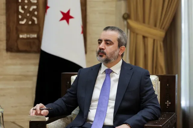 Ngoại trưởng Syria Asaad al-Shaibani trong một cuộc phỏng vấn với Reuters tại Damascus, Syria, ngày 22 tháng 8 năm 2026. REUTERS/Khalil Ashawi