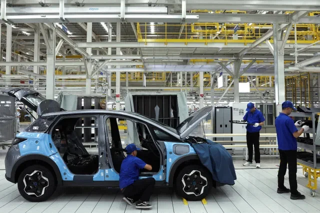 Workers assemble an EV car inside BYD's first electric vehicle (EV) factory in Southeast Asia, a fast-growing regional EV market where it has become the dominant player, in Rayong, Thailand, July 4, 2024. REUTERS/Chalinee Thirasupa