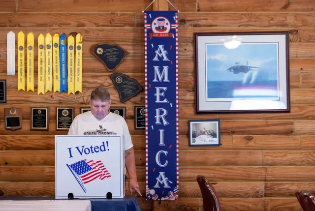 A voter casts his ballot at a polling station in a Republican primary runoff between U.S. Senator Darline Graham (R-SC) and U.S. Representative Ralph Norman (R-SC) for the U.S. Senate seat, in Cayce, Lexington County, South Carolina, U.S., August 25, 2026. REUTERS/Sam Wolfe