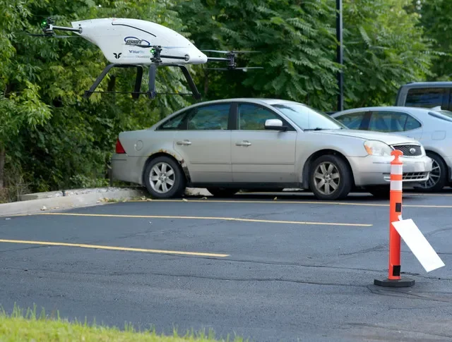 A blueflite drone operated by Airspace Link comes in for a landing carrying auto parts in its body to the nearby parts department at Jack Demmer Ford in Wayne on Tuesday, Aug. 25, 2026.