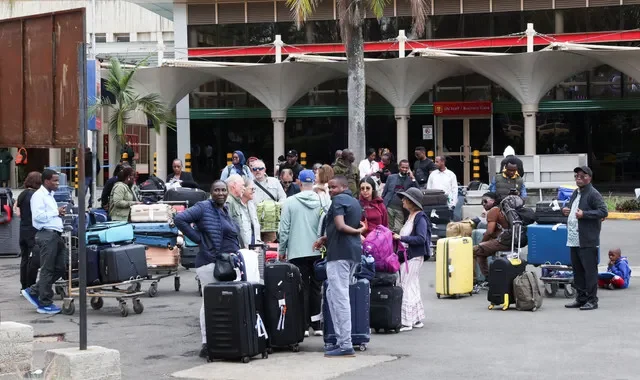 Stranded travellers wait with their luggage after their flights were canceled due to a strike by workers at the Jomo Kenyatta International Airport (JKIA) in Nairobi, Kenya, August 31, 2026. REUTERS/Monicah Mwangi