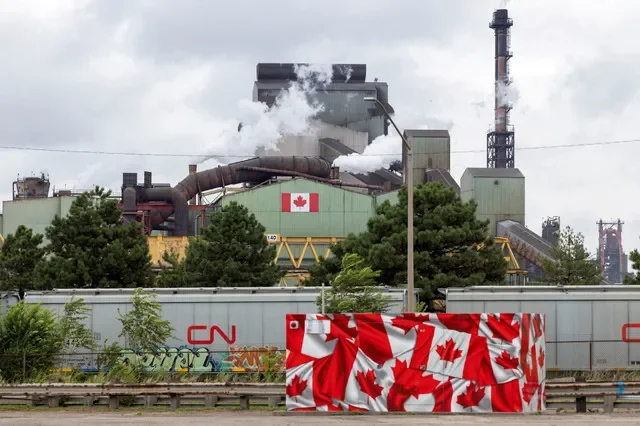 FILE PHOTO: Flags adorn the ArcelorMittal Dofasco steel plant as trade tensions escalate over U.S. tariffs and retaliatory measures by Canada in Hamilton, Ontario, Canada, August 24, 2026. REUTERS/Carlos Osorio/File Photo
