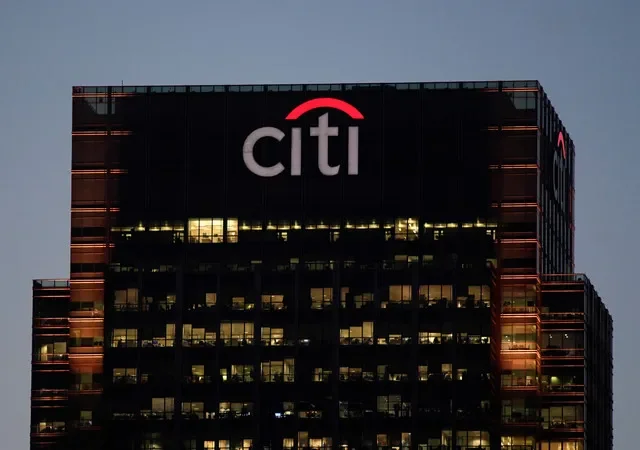 FILE PHOTO: Workers are seen in at Citibank offices in the Canary Wharf financial district in London, Britain, November 17, 2017. REUTERS/Toby Melville/ File Photo
