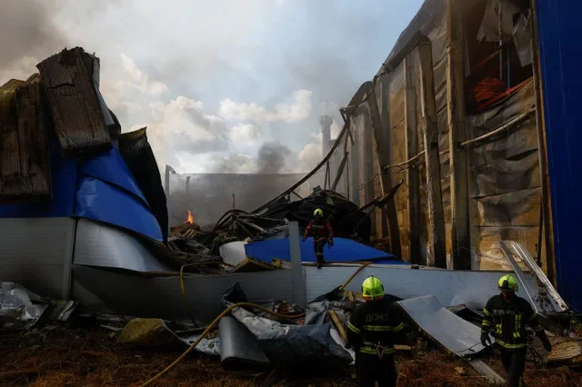 Firefighters work at the site of a warehouse hit by a Russian drone strike in the town of Brovary, amid Russia's attack on Ukraine, in Kyiv region, Ukraine September 4, 2026. REUTERS/Valentyn Ogirenko