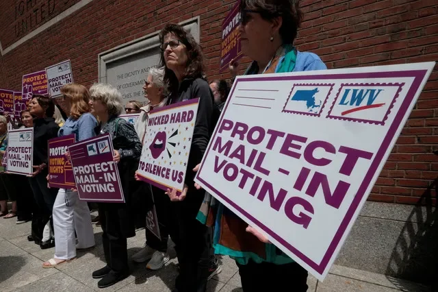 Supporters gather outside the federal courthouse after a hearing in a lawsuit brought by a coalition of Democratic state attorneys general seeking to block U.S. President Donald Trump's executive order tightening rules on mail-in voting, in Boston, Massachusetts, U.S., June 2, 2026. REUTERS/Brian Snyder