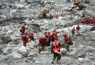 Chinese rescue workers operated excavators and radar detectors on Sunday to search for hundreds missing after a devastating mudslide wiped out the main border crossing with Nepal. The disaster followed the collapse of a glacier on August 26, leaving little trace of the once-busy port.