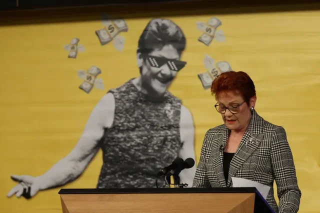 FILE PHOTO: Australian Senator and One Nation leader Pauline Hanson reacts as a banner appeared during her address to the National Press Club in Canberra, Australia, June 17, 2026. REUTERS/Hollie Adams/File Photo