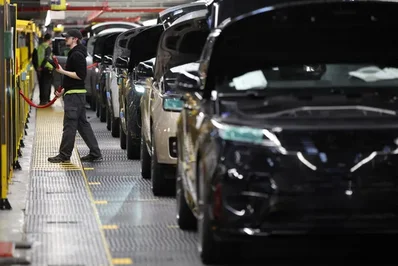 Jaguar Land Rover plans to cut nearly 10 percent of its workforce through voluntary redundancies over two years. The luxury carmaker aims to save 1.7 billion pounds amid intense competition and tariffs.