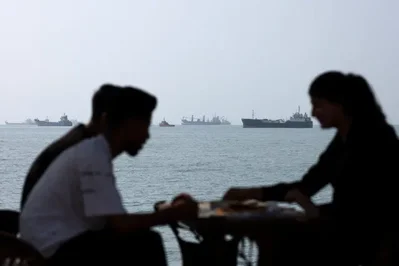 Middle East hostilities pushed oil near $100 a barrel as U.S. markets reacted with caution. Meanwhile, the Japanese yen extended strong gains to reach a seven-month high against the dollar.