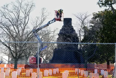 The Trump administration removed language criticizing a Confederate memorial from an agency website. The 32-foot bronze statue was previously removed from Arlington National Cemetery in 2023.
