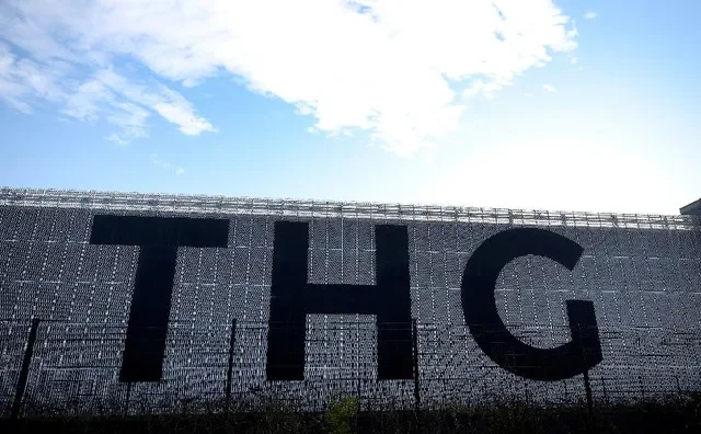 Signage is seen on a THG warehouse building in Manchester, Britain, January 18, 2022. REUTERS/Phil Noble