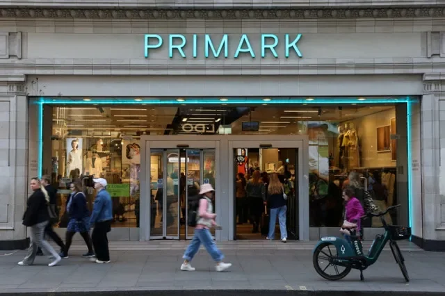 People walk outside a Primark store on Oxford Street in London, Britain, April 19, 2026. REUTERS/Jack Taylor