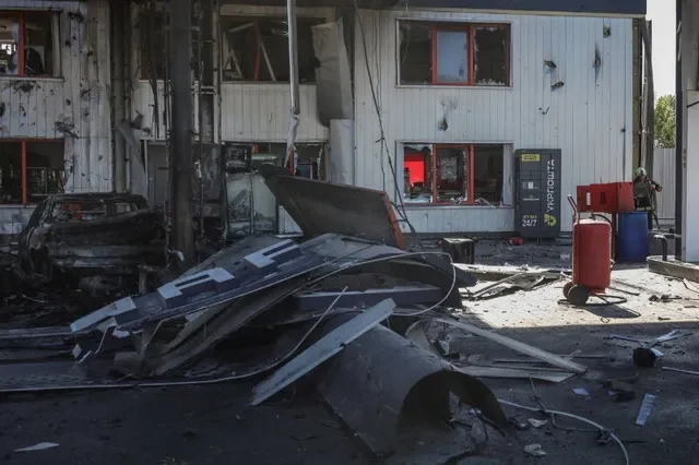 A firefighter works at a site of a gas station hit by a Russian drone strike, amid Russia's attack on Ukraine, in Kyiv, Ukraine September 10, 2026. REUTERS/Alina Smutko