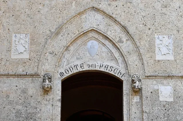 View of the entrance to the headquarters of Monte dei Paschi di Siena (MPS), the oldest bank in the world, which is facing massive layoffs as part of a planned corporate merger, in Siena, Italy, August 11, 2021. REUTERS/Jennifer Lorenzini/File Photo
