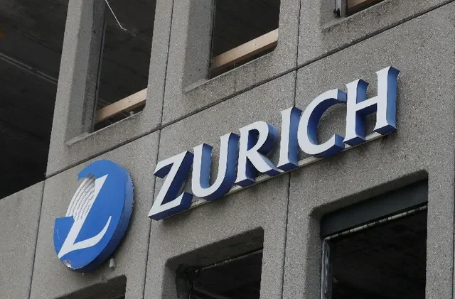 FILE PHOTO: The logo of Zurich Insurance is seen at a former office building in Zurich, Switzerland November 11, 2021. REUTERS/Arnd Wiegmann/File Photo
