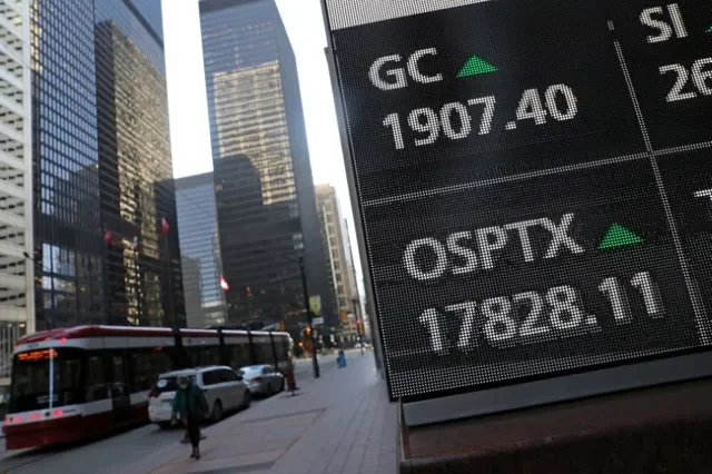 A screen shows a price of Canada's main stock index, the Toronto Stock Exchange's S&P/TSX composite index, as it rose to a record high in Toronto, Ontario, Canada January 7, 2021. REUTERS/Chris Helgren