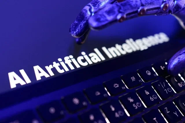 FILE PHOTO: Words "AI Artificial Inteligence", keyboard, and a robotic hand in this illustration taken June 5, 2026. REUTERS/Dado Ruvic/Illustration/File Photo