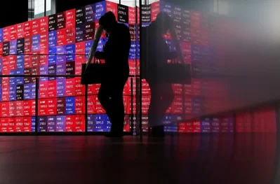 Asian Shares Slide on Oil Spike and Rate Hike Risks