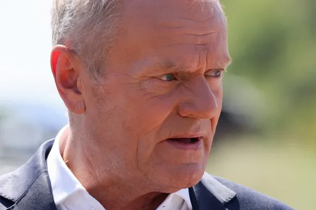 Polish Prime Minister Donald Tusk speaks to the press, near a crater in a field left by an unidentified object that appears to be a Russian missile, Polish Prime Minister Donald Tusk said on Thursday, near the village of Tarnawa-Kolonia in Lublin province, Poland, July 30, 2026. REUTERS/Kuba Stezycki