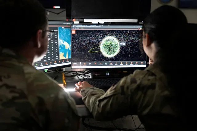 U.S. Space Force Guardians assigned to Space Delta 5 monitor computer workstations at Vandenberg Space Force Base, California, U.S., December 18, 2025. U.S. Space Forces/David Dozoretz/Handout via REUTERS