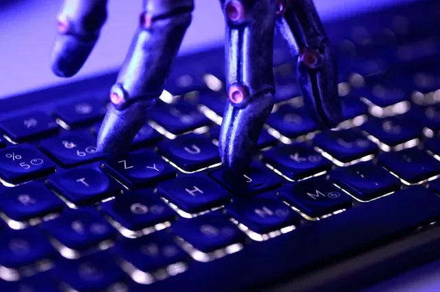 FILE PHOTO: A keyboard and a robotic hand in this illustration taken June 5, 2026. REUTERS/Dado Ruvic/Illustration/File Photo