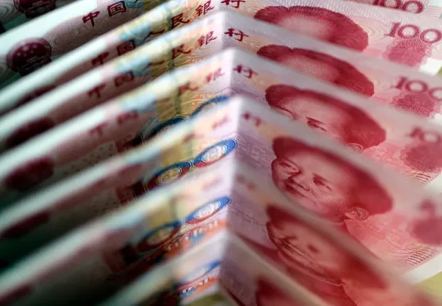 One-hundred Yuan notes are seen in this picture illustration in Beijing March 22, 2011. REUTERS/Jason Lee