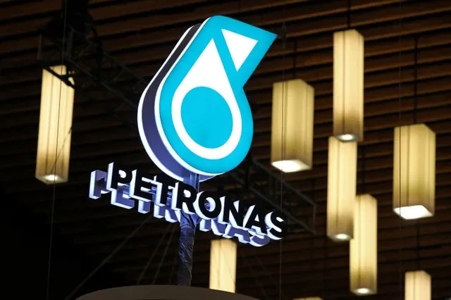 FILE PHOTO: The logo of Malaysian energy group PETRONAS is displayed at their booth during the LNG 2023 energy trade show in Vancouver, British Columbia, Canada, July 12, 2023. REUTERS/Chris Helgren/File Photo