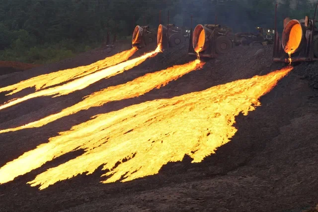 Hot slag flows from trucks to the dumping site at the nickel processing plant operated by PT Vale Indonesia in Sorowako, South Sulawesi province, Indonesia July 28, 2023, in this photo taken by Antara Foto. Antara Foto/Jojon/via REUTERS