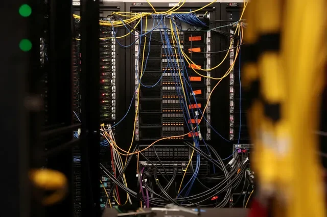 FILE PHOTO: Cables fill a data center built to run software and other tests on networking chips as Broadcom prepares to launch new optical chip tech to fend off Nvidia in San Jose, California, U.S., September 5, 2025. REUTERS/Brittany Hosea-Small/File Photo