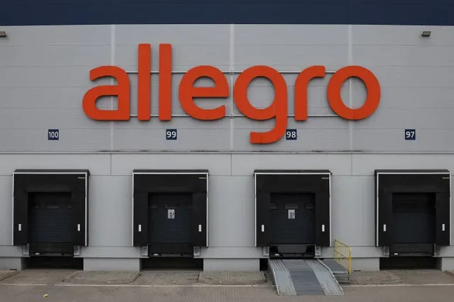 FILE PHOTO: Polish marketplace Allegro logo hangs above loading bays at their distribution centre, ahead of the Christmas season, in Adamow, Poland December 11, 2024. REUTERS/Kacper Pempel/File Photo