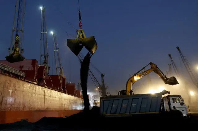 A crane is used to unload coal from a cargo ship at the Deendayal Port in Kandla, in the western state of Gujarat, India, April 4, 2025.REUTERS/Amit Dave