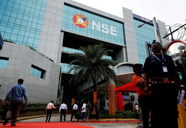 FILE PHOTO: A guard stands at the gate of the National Stock Exchange (NSE) in Mumbai, India, September 6, 2024. REUTERS/Francis Mascarenhas/File Photo