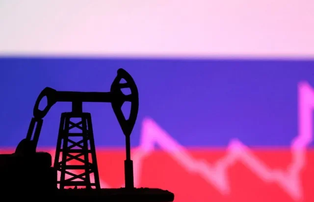 Russian flag with stock graph and an oil pump jack miniature model are seen in this illustration taken October 9, 2023. REUTERS/Dado Ruvic/Illustration