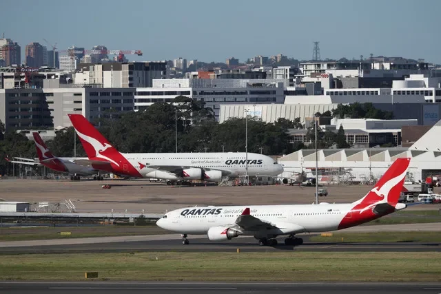 FILE PHOTO: Qantas planes are seen at Kingsford Smith International Airport in Sydney, Australia, March 18, 2020.