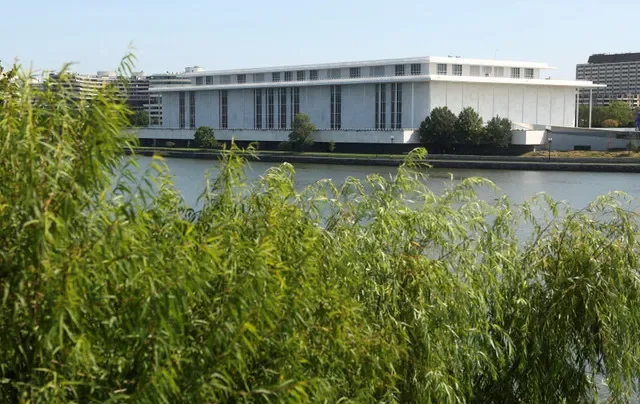 FILE PHOTO: A view of the John F. Kennedy Center for the Performing Arts above tree branches, after President Donald Trump's administration argued in a court filing that the building could eventually face demolition if major repairs are not undertaken, in Washington, D.C., U.S., August 26, 2026. REUTERS/Kevin Lamarque/File Photo