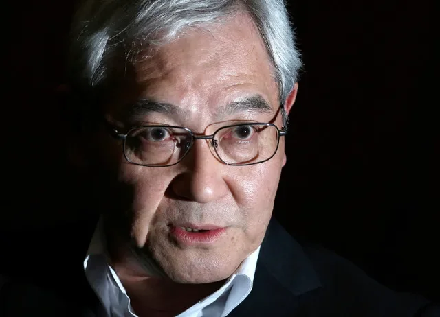 Bank of Japan's (BOJ) board member Makoto Sakurai speaks during an interview with Reuters at the BOJ headquarters in Tokyo, Japan, September 1, 2016. REUTERS/Toru Hanai/File Photo