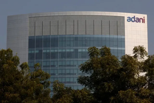 FILE PHOTO: The logo of the Adani Group is seen on the facade of its Corporate House on the outskirts of Ahmedabad, India, November 22, 2024. REUTERS/Amit Dave/File Photo