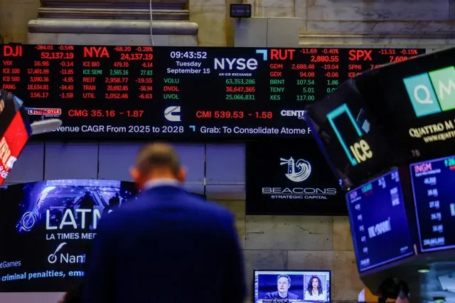 FILE PHOTO: A screen displays stock market information after the opening bell at the New York Stock Exchange (NYSE) in New York City, U.S., September 15, 2026. REUTERS/Jeenah Moon/File Photo